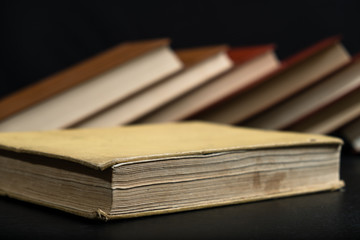 Old book on wooden background.