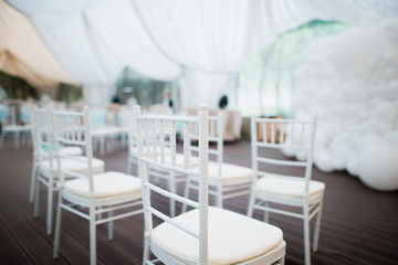 White chairs, beautiful decoration for wedding day.