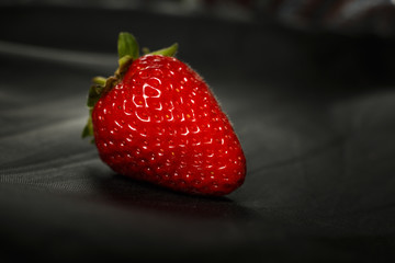 Fresh red strawberry isolated on a black background