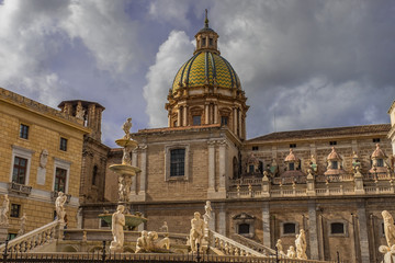 Fototapeta na wymiar The Praetorian Fountain and baroque dome of Santa Caterina in Palermo, Sicily