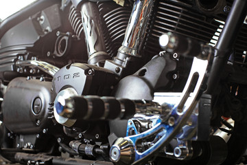 Cropped close up shot of beautiful and custom made motorcycle in the workshop