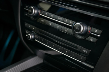 Car climate panel with control buttons. Interior detail.