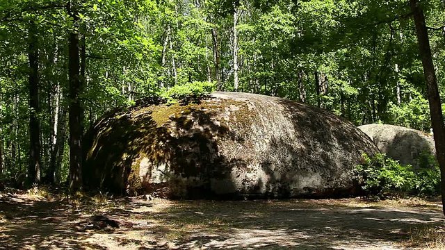 big stones in the forest, The tract stone village, Zhytomyr region village of Rudnya- Zamyslovichskaya, boulders covered with moss in a park