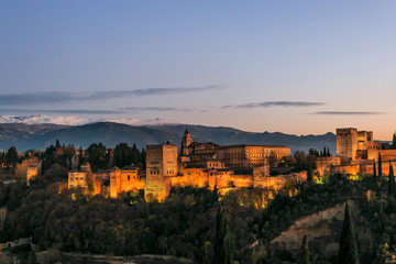 Granada España. Panoramic view of Alhambra palace and fortress with Sierra Nevada at the background. Travel destination in Spain