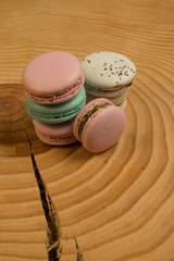 Colorful French or Italian macaron on the wood table with copy space for background. Macarons or macaroons is French dessert