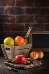 Fresh red apples with cinnamon sticks