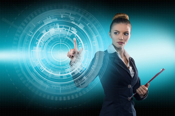 Young business lady works with virtual graphic interface in futuristic office