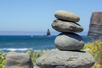 Fototapeta na wymiar Balanced Rocks by Beach