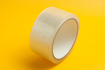 adhesive tape on yellow bright background