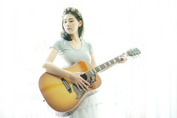 Beautiful woman playing guitar