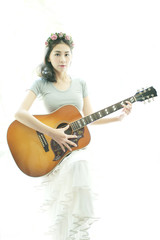 Beautiful woman playing guitar