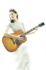 Beautiful woman playing guitar