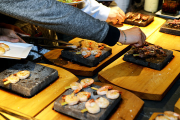 A Hand Grabbing Shrimp at a Buffet