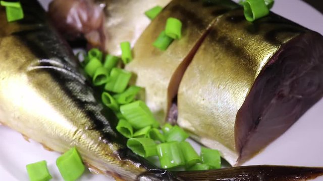 smoked, salted, boiled fish with green onions rotates. delicious food.