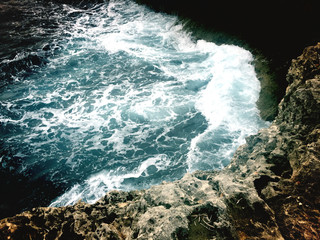 ocean breakers with rocks in color contrast