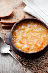 Kapustnyak - traditional ukrainian winter soup with sauerkraut, millet and meat