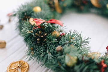 Christmas wreath on a white wooden background