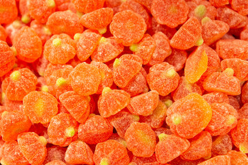 Orange And Yellow Jelly Pumpkins or Mandarins. Top View. Background Candies Close-up.