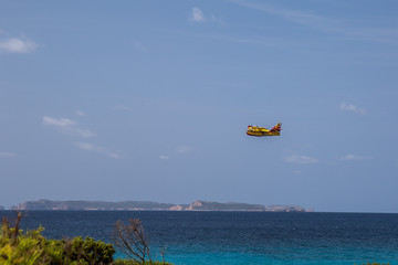 sea blue sky and  yellow plane