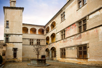 Fototapeta premium Issogne: Castle of Issogne. The courtyard with the pomegranate fountain. Val D'aosta, Italy.