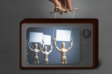 Fake News on TV. Provocateur puppet activist is calling people to protest. Hand-held puppet doll on the ropes and crowd of people with posters for rally.