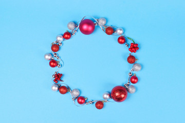 Modern Christmas wreath on blue background.
