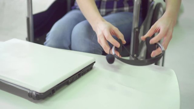 concept idea, successful employee man in a wheelchair in the office