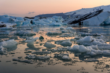 Floating icebergs during sunset at Jokulsarlon in south Iceland