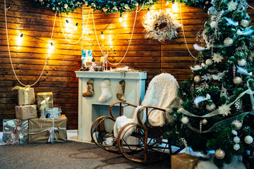 Romantic classical christmas interior with warm light, wooden elements and presents
