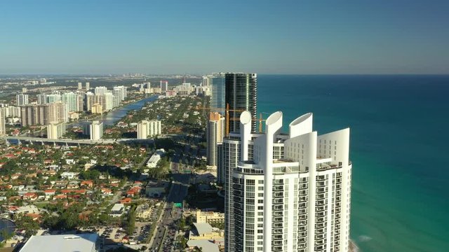 Aerials flying over highrise architecture Miami FL USA Sunny Isles Beach