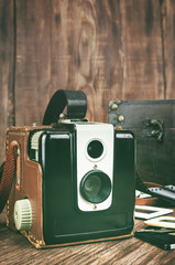 Retro camera on wooden background