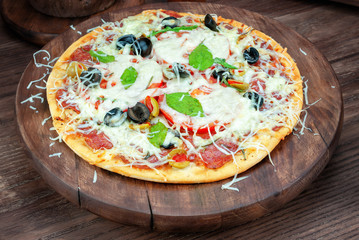 Pizza on wooden background