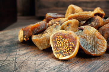 Dried figs on wooden table