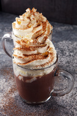 Hot chocolate cocoa with whipped cream for xmas on table