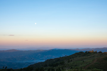 Mountain view with moon in morning.