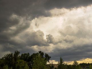 Summer cloudy sky before the rain. The terrain in southern Europe.