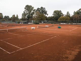 rural, abandoned tennis court in autumn.