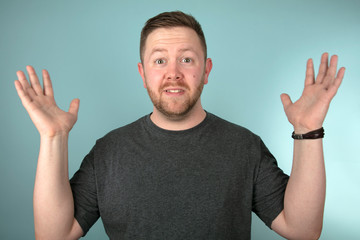 Man staring at the camera in astounded