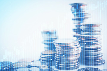 money coins arranged as a graph on white background