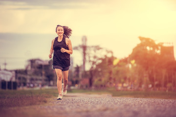 beautiful Asian girls Jogging in the park,Healthy Concept