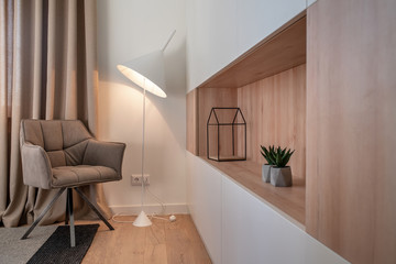 Stylish modern interior with white walls and luminous lamp