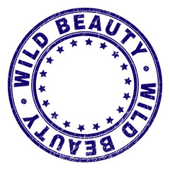 WILD BEAUTY stamp seal watermark with grunge style. Designed with circles and stars. Blue vector rubber print of WILD BEAUTY title with grunge texture.