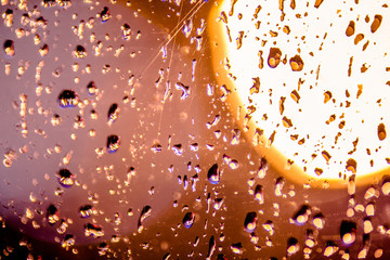 Night city lights in the window in the rain 