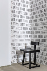 Dark wooden chair on the concrete floor
