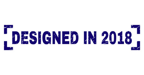 DESIGNED IN 2018 caption seal stamp with grunge texture. Text caption is placed between corners. Blue vector rubber print of DESIGNED IN 2018 with grunge texture.