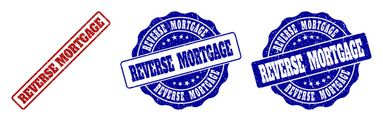 REVERSE MORTGAGE grunge stamp seals in red and blue colors. Vector REVERSE MORTGAGE signs with distress surface. Graphic elements are rounded rectangles, rosettes, circles and text tags.