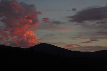 Sunset over Mt. Spokane causes the clouds to look like an eruption