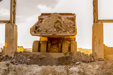 Mining dump trucks transporting Platinum ore for processing © Sunshine Seeds