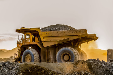 Mining dump trucks transporting Platinum ore for processing © Sunshine Seeds
