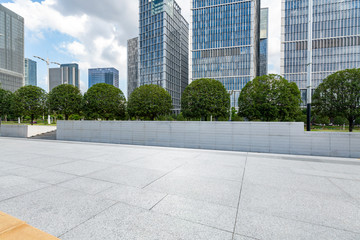 Panoramic skyline and modern business office buildings with empty road,empty concrete square floor